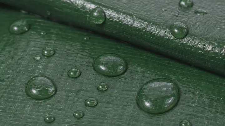 Waterproof check on laminated tarpaulin fabric