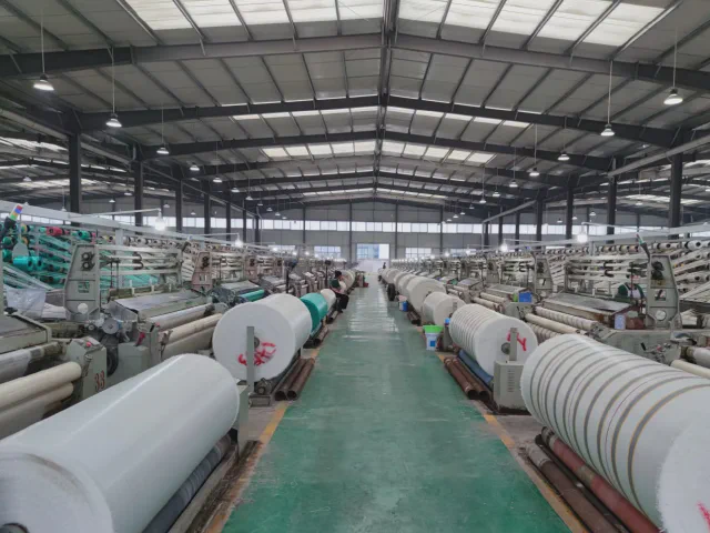 PP PE woven roll production workshop with roll fabric lines and factory equipment